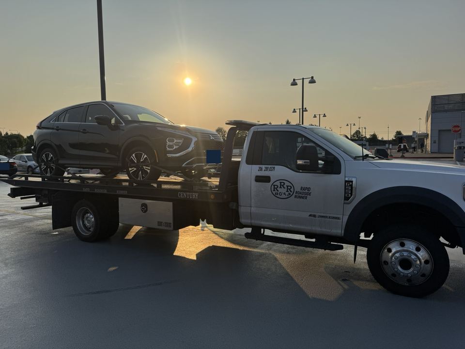 SUV carried on our flatbed truck